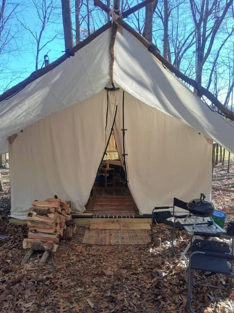 The lit front porch with ramp to enter tent.