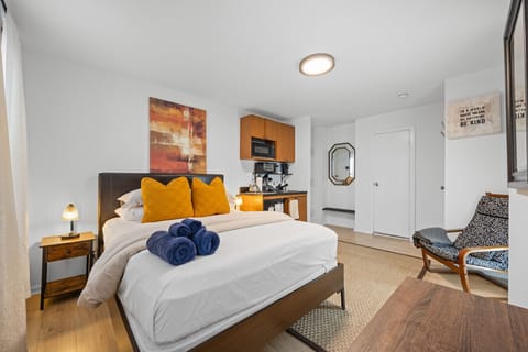 A cozy double bed with plush linens, sleeps 2