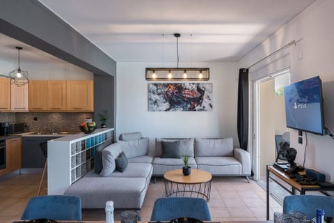 Open plan design, seamlessly blending the living room and kitchen into a harmonious space.