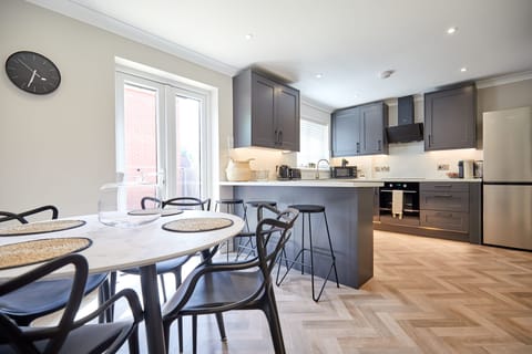 Modern new kitchen with all cook-wear you will need to make and prepare meals.