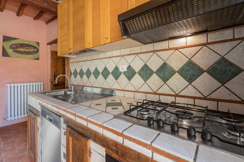 Property, Cabinetry, Countertop, Kitchen Stove, Wood, Kitchen, Tap, Interior Design, Building, Flooring