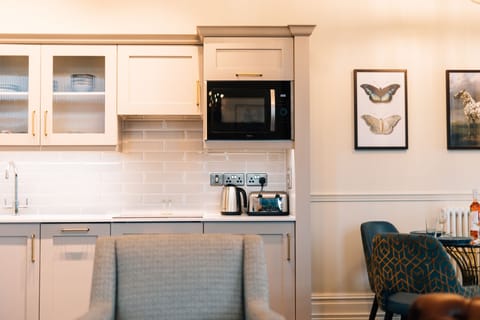 Grand Suite | Living area | 55-inch LED TV with satellite channels, DVD player