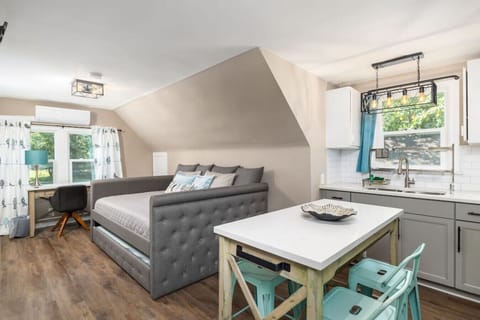 Custom made dining table and office desk with matching quartz tops to match the kitchen.  The desk has a window for natural daylight and enjoying great views if your working while hanging out at this private paradise.