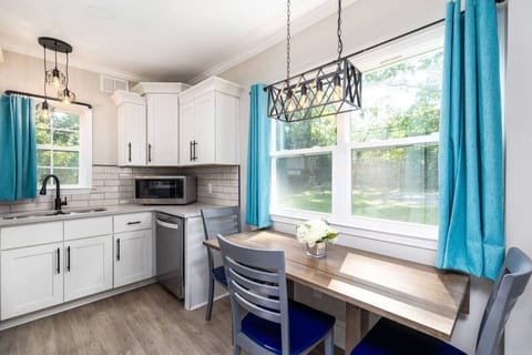 Prepare and enjoy a meal in this fully stocked kitchen/dining room.