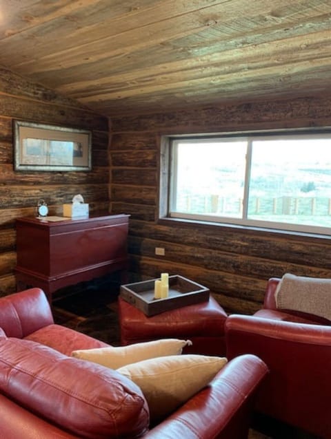 Cozy leather furniture invites you to sit and read or enjoy the stunning views of the West Elk Mountains