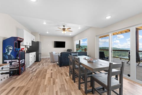 Game room with arcade machines, foosball, Smart TV, and table for games.—this space is built for memory-making fun! 