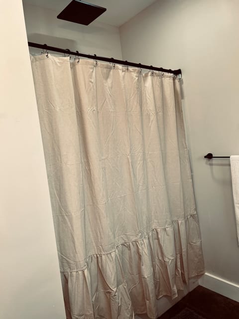 Master shower with rain shower and tub