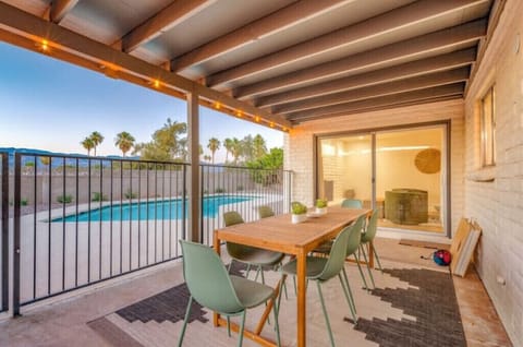 outdoor dining for 8, with BBQ and yard games (cornhole)