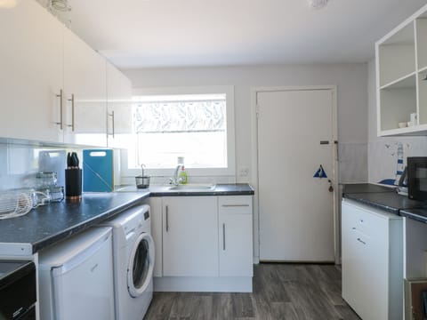 Fridge, electric kettle, toaster, cookware/dishes/utensils