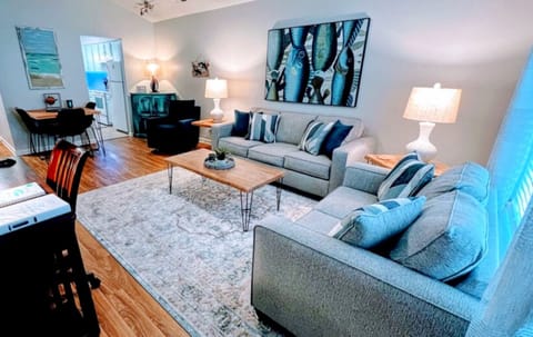 Spacious living area with queen sleeper sofa.