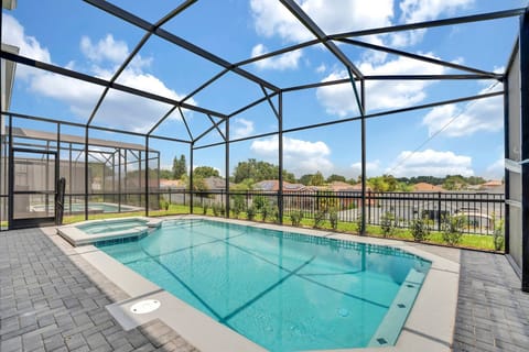 Your private pool and spa — no rear neighbors, just your group and the Florida sky.