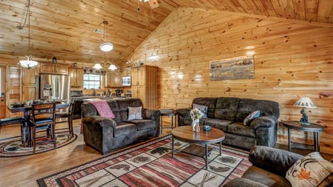 Living Room: Rustic charm meets modern comfort—perfect for game nights and family gatherings!