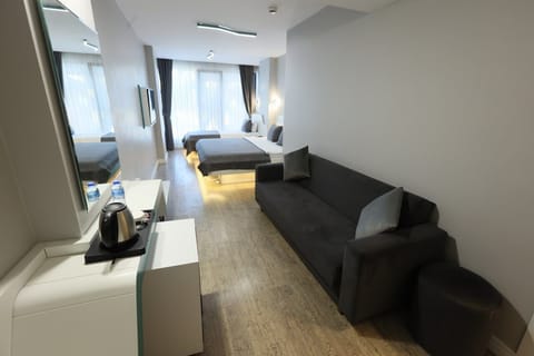 Family Quadruple Room, 1 Bedroom, Air conditioning, City View | Living area | 43-inch LCD TV with satellite channels