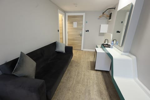 Family Quadruple Room, 1 Bedroom, Air conditioning, City View | Living area | 43-inch LCD TV with satellite channels