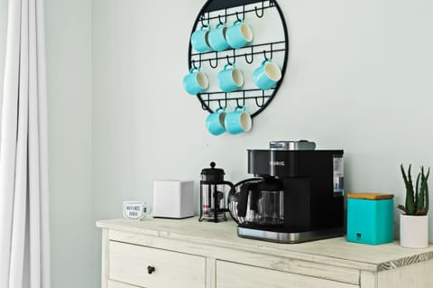 A well-equipped coffee bar stocked with all the essentials for your morning cup, ensuring a delightful and customized brewing experience.




