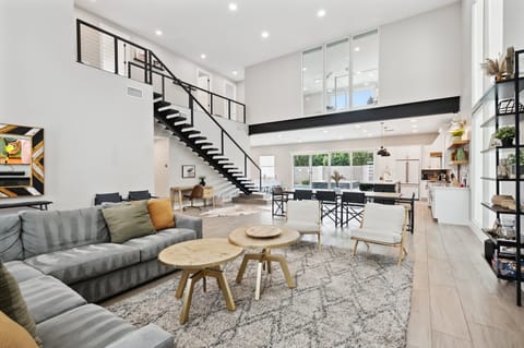 Open floor plan with 2 living areas. Large sectionals, TVs with YouTube TV cable provided