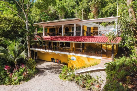 Secluded tropical villa with wraparound verandas and lush jungle views