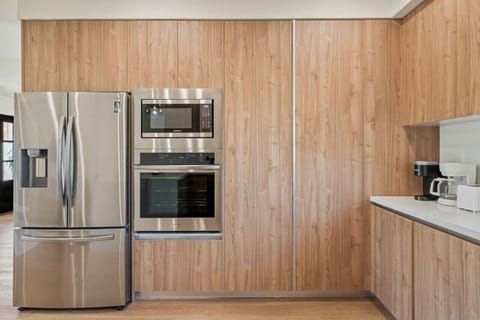 Double door stainless steel frigde with built in stainless steel microwave and stainless steel oven