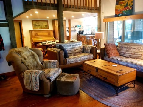 Living room looking across dining area towards kithen.