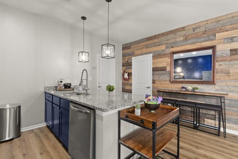 Open concept kitchen, additional high top seating and storage make this an outstanding gathering place.