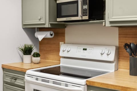 4 burner electric stove and microwave.