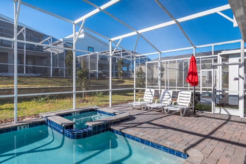 Private screened-in pool & spa with lounge chairs and sunny vibes!