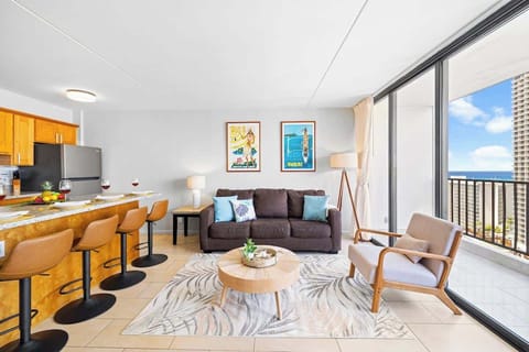Bask in the aloha spirit in your bright, tropical-inspired living area opening up to great ocean views.
