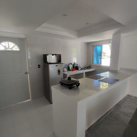 Comfort Villa | Private kitchen | Mini-fridge, microwave, griddle, cookware/dishes/utensils