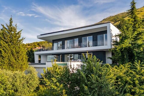 Luxury villa in Shirokë Albania surrounded by pine trees with pool and Albanian Alps views.