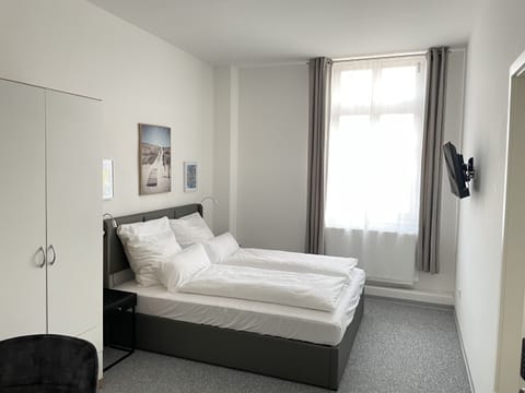 Comfort Double Room, Private Bathroom | Desk, laptop workspace, blackout drapes, iron/ironing board