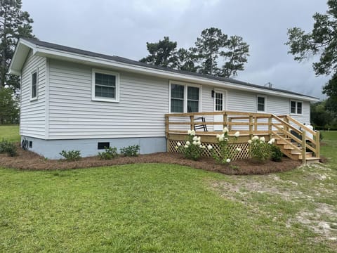 Rear of house. Have added gutters and painted porch since this picture.