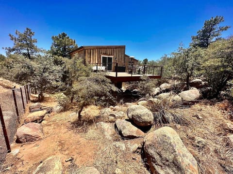 Fully fenced backyard with boulders