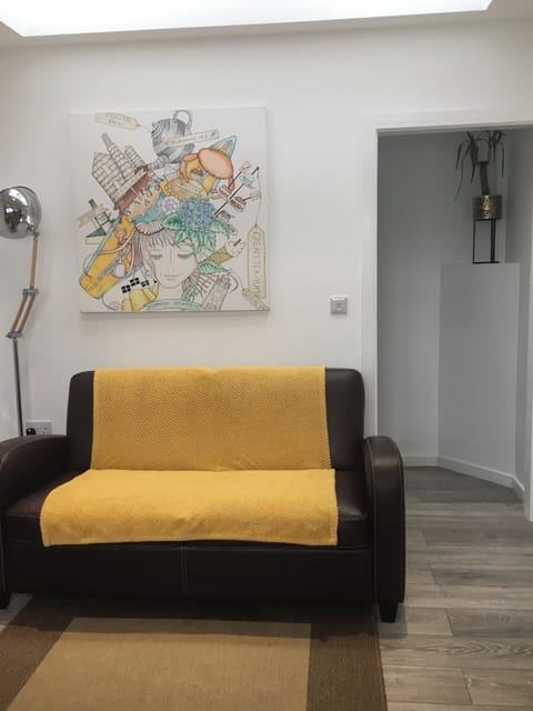Lounge with Artwork, Sofa Bed & Door to En-Suite Bedroom