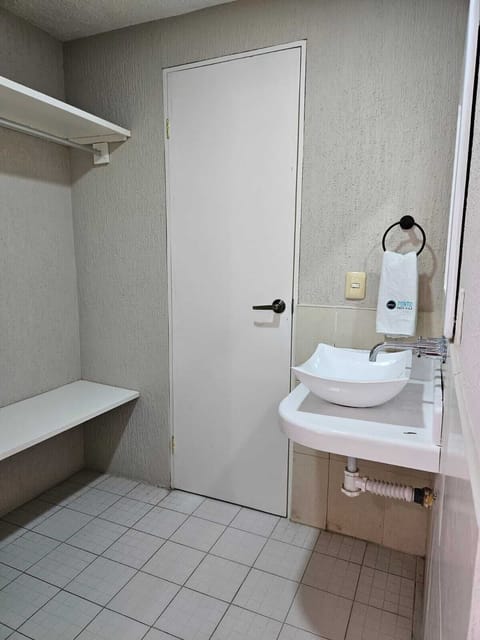 Basic Double Room | Bathroom | Shower, rainfall showerhead, towels, soap