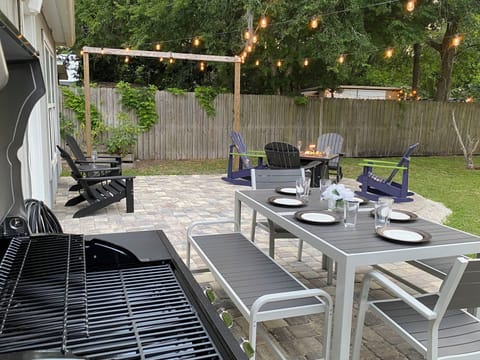 The patio area has lots of seating & is equipped with a BBQ gas grill & Fire pit