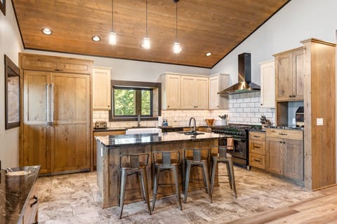 The island provides seating for four to enjoy a cup of coffee or glass of wine while a meal is being prepared | Upper Level