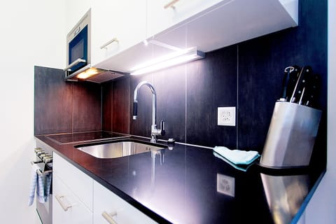 Apartment | Private kitchenette | Full-size fridge, microwave, stovetop, dishwasher