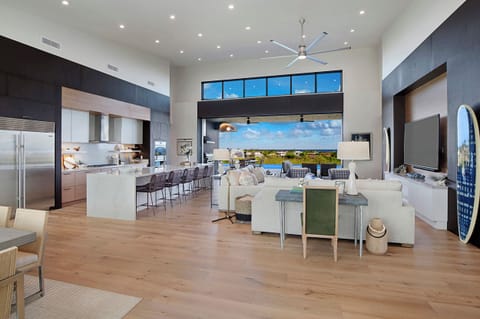 Endless relaxation awaits with panoramic views from indoor to outdoor living spaces and infinity pool