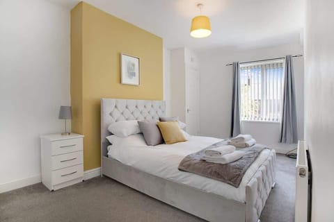 Bedroom 1 offers flexibility and comfort with a cozy double bed, ensuring a restful retreat for a peaceful night's sleep.