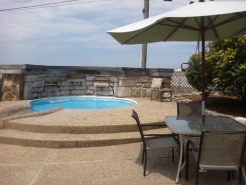 Seasonal outdoor pool, open 7:00 AM to 11:00 PM, pool umbrellas