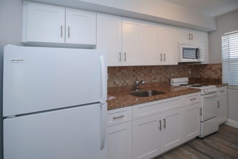 Suite, 1 Bedroom (101) | Private kitchen | Fridge, microwave, coffee/tea maker, cookware/dishes/utensils