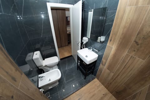 Deluxe Room | Bathroom | Hair dryer, bathrobes, towels, soap