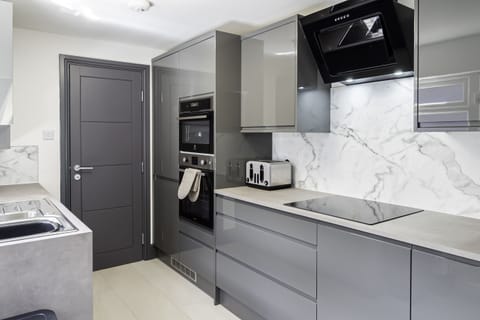 Sparkling countertops and stainless steel appliances create a clean and modern aesthetic look purposely designed to unleash your culinary creativity.