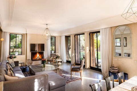 Deluxe Villa | Living area | Flat-screen TV