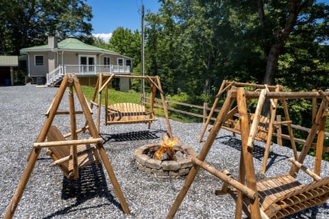 Outdoor Area - Outdoor fire pit area with wooden swings