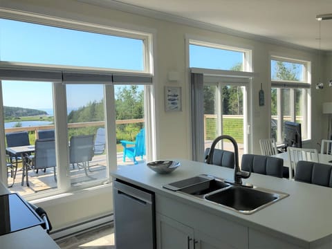 Enjoy ocean views from the fully equipped, open-concept kitchen.