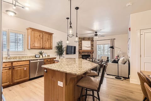 Cook like a pro in this gourmet kitchen featuring granite countertops, stainless steel appliances, and custom wood cabinetry