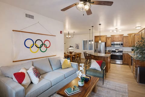 Relax in this stylish Park City retreat featuring a cozy stone fireplace, Olympic-themed decor, and mountain-view balcony. Just minutes from Canyons Village with access to a private clubhouse.