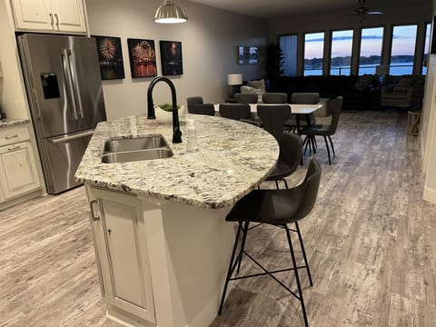 Open floor plan allows conversations and lake views and sunsets while cooking