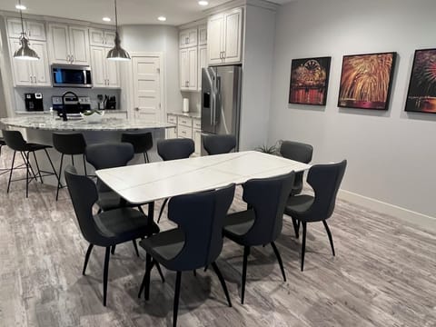 Enjoy dinner with family and friends -- dining table seats 8, island seats 4